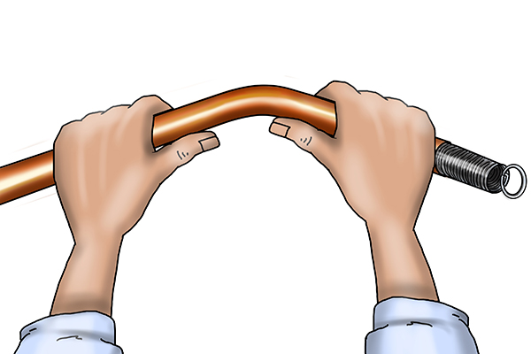 image of someone bending a metal pipe